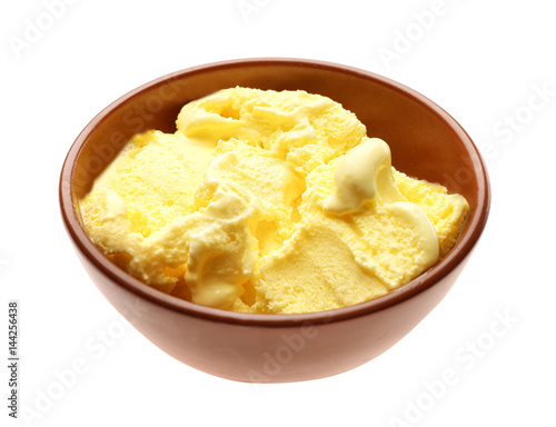 Tasty lemon ice cream in bowl on white background