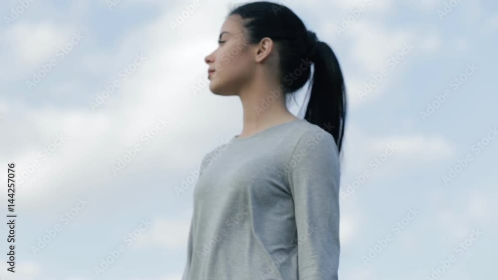 Woman enjoying a freedom, blue sky background Woman enjoying a freedom, blue sky background