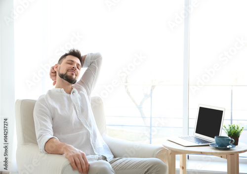 Happy young man resting in ...