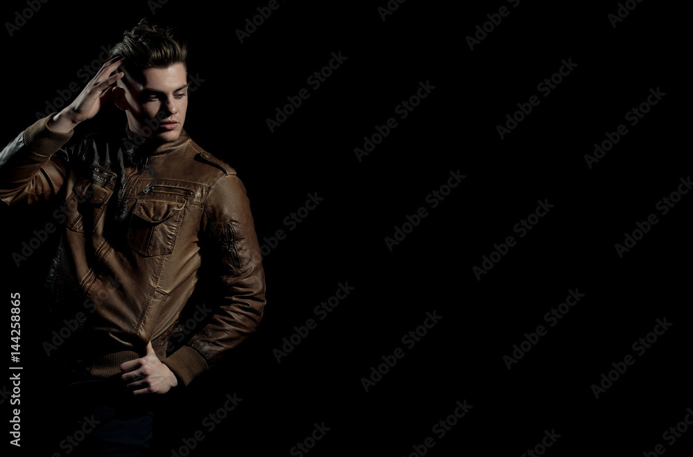 Handsome man posing in brown, leather jacket Handsome man posing in brown, leather jacket