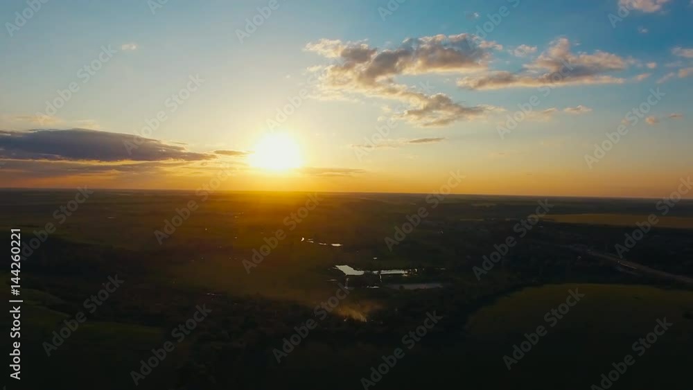 Flying over the lield at Sunset Flying over the lield at Sunset