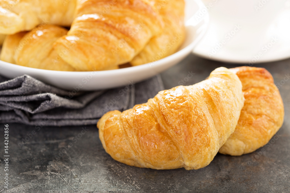 Freshly baked croissants in a bowl