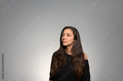 Studio portrait of a pensive young woman