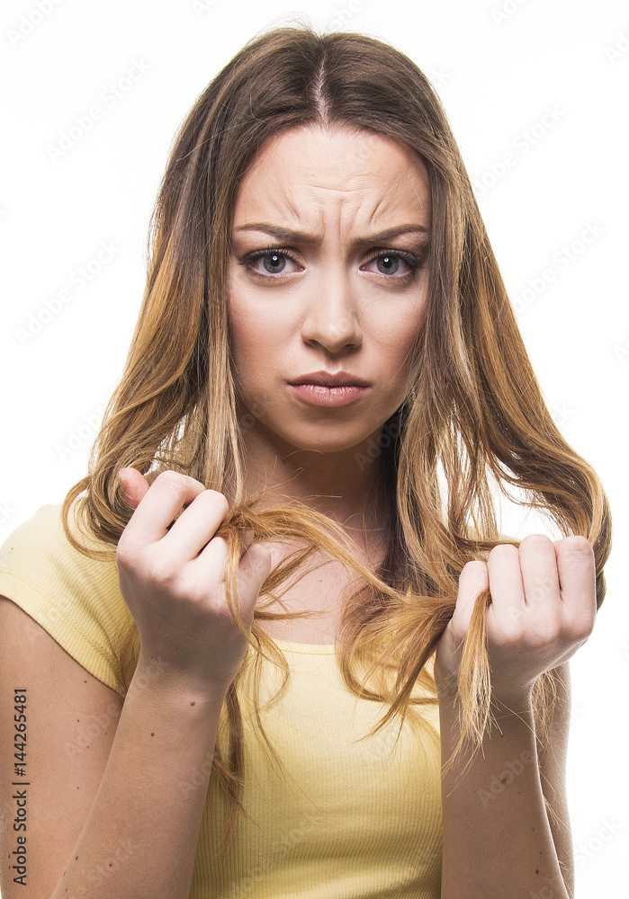 beautiful girl unhappy with her damaged and dry hair beautiful girl unhappy with her damaged and dry hair