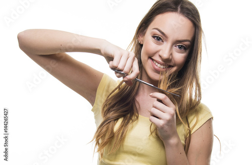 beautiful girl unhappy with her damaged and dry hair photo