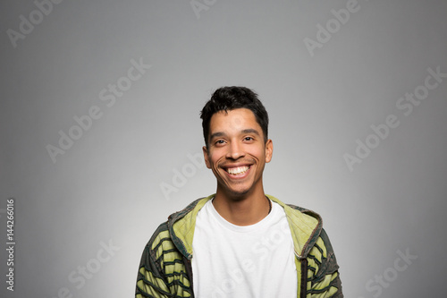Studio portrait of an excited young man