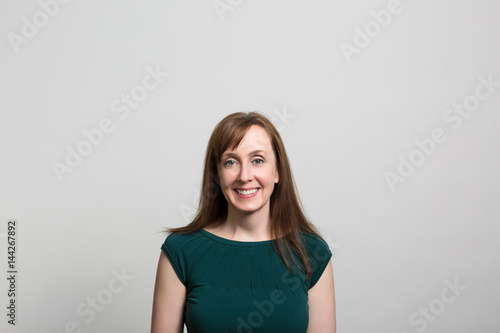 Studio portrait of a smiling woman