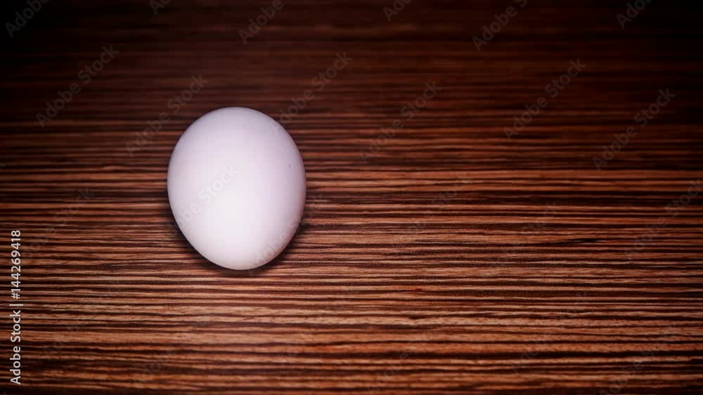 The egg rotates in slow motion. The egg rotates in slow motion.