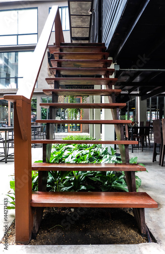 Wooden stairs at the outside of restaurant, interior or modern concept
