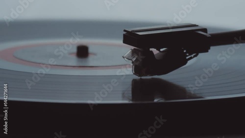 Old vintage gramophone playing lp vinyl record photo