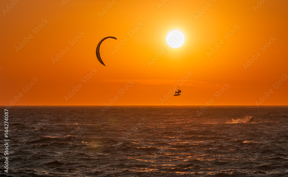 Kite surf and sunset at Mykonos island, Greece. Kite surf and sunset at Mykonos island, Greece.