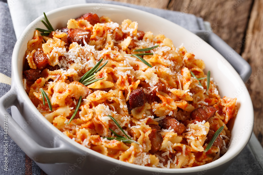 Baked pasta with tomato, bacon and cheese close-up. horizontal Baked pasta with tomato, bacon and cheese close-up. horizontal