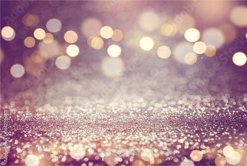 Pink or purple glitter and gold lights bokeh background. defocused