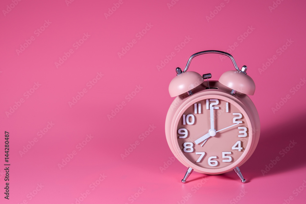 alarm clock on pink background alarm clock on pink background