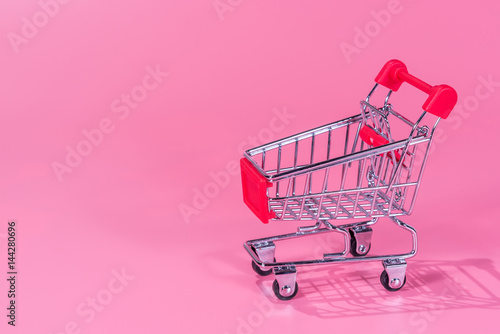 shopping cart on pink background