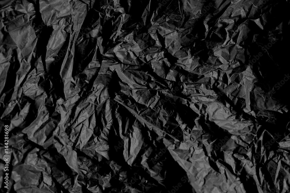 Black crumpled paper texture background Black crumpled paper texture background