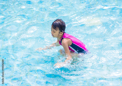 Asian Kid (Girl) in Swimming Pool