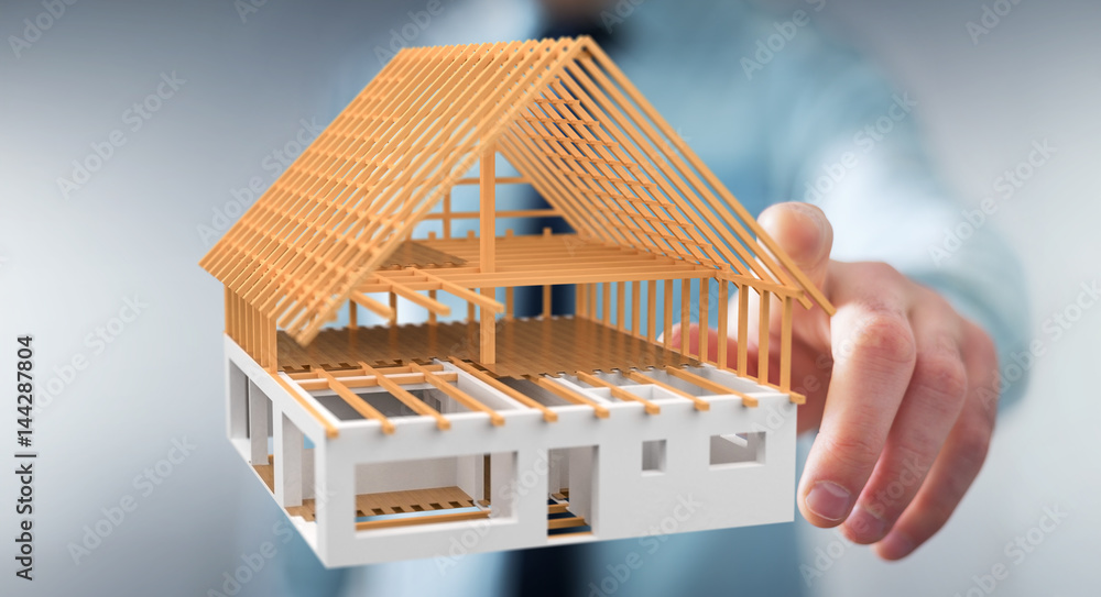 Naklejka premium Businessman touching 3D rendering unfinished plan house with his finger