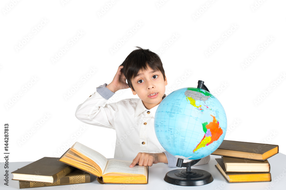 the boy studies the globe and reads the book. the boy studies the globe and reads the book.