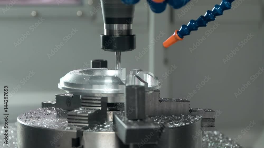 Metalworking CNC milling machine. Cutting metal modern processing technology. Small depth of field. Metalworking CNC milling machine. Cutting metal modern processing technology. Small depth of field.