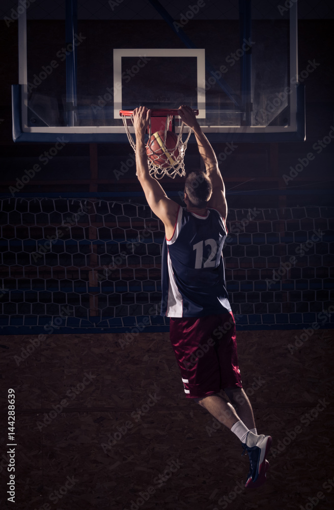 Fototapeta premium basketball player slam dunk, in air