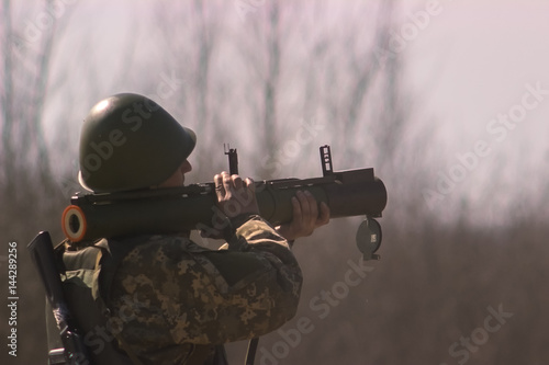 Military shooting from bazooka at warfield