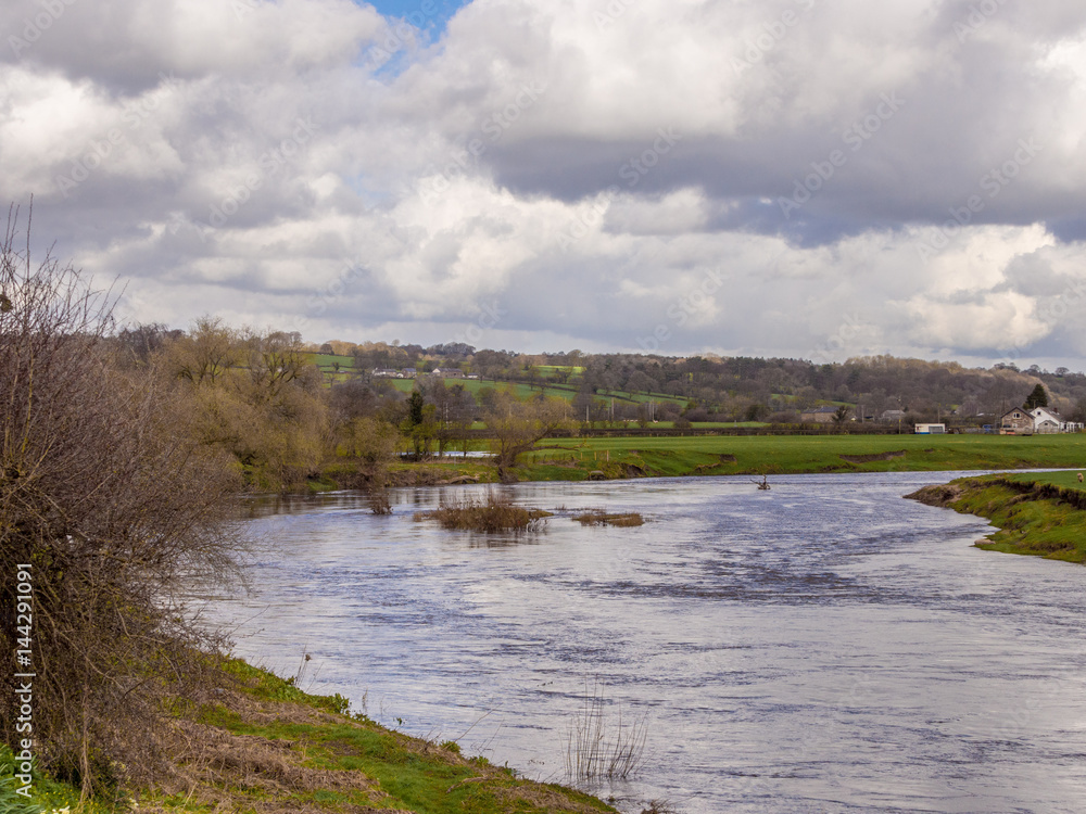 The river Ribble at Ribchester in sunshine after earloier heavy rain and hailstones, Ribchester, Lancashire, UK