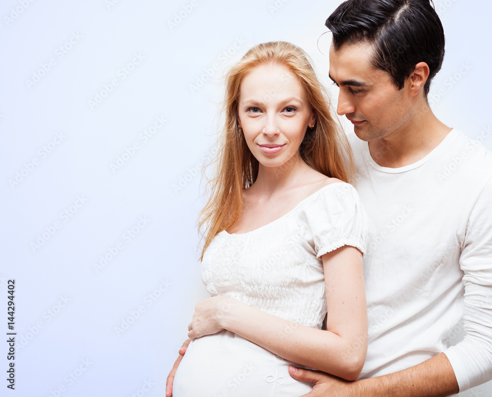 Pregnant couple shoot in studio. Pregnant couple shoot in studio.