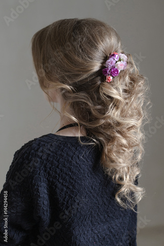Flower hairpin on curly hair