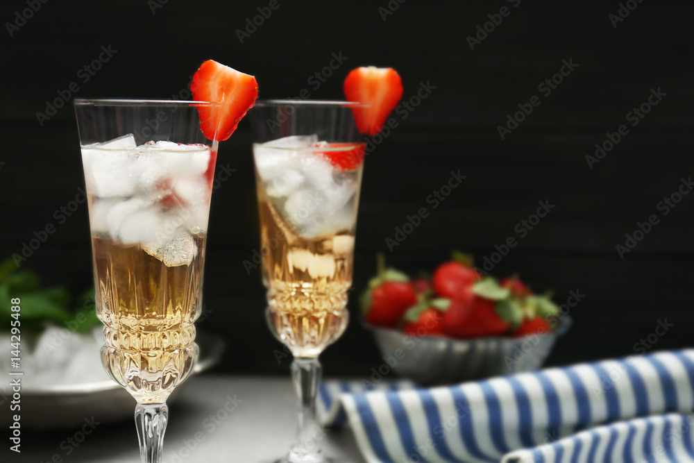 Refreshing cocktails with strawberry on gray table Refreshing cocktails with strawberry on gray table