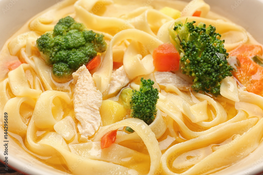 Chicken noodle soup in bowl, closeup