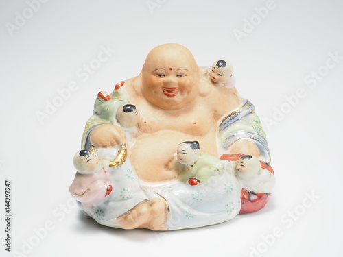 Smiling Buddha and lineage or Kasennen figure on white background photo