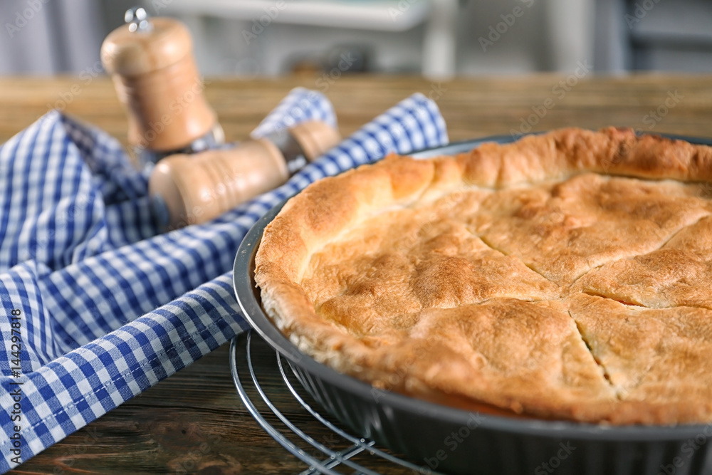 Baked chicken pot pie in baking dish on table Baked chicken pot pie in baking dish on table