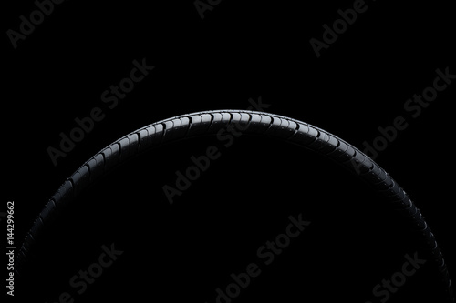 Car tire on black background