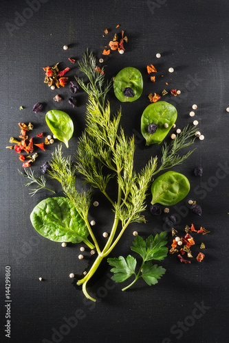 Spinach and greens  dill and parsley on chalkboard