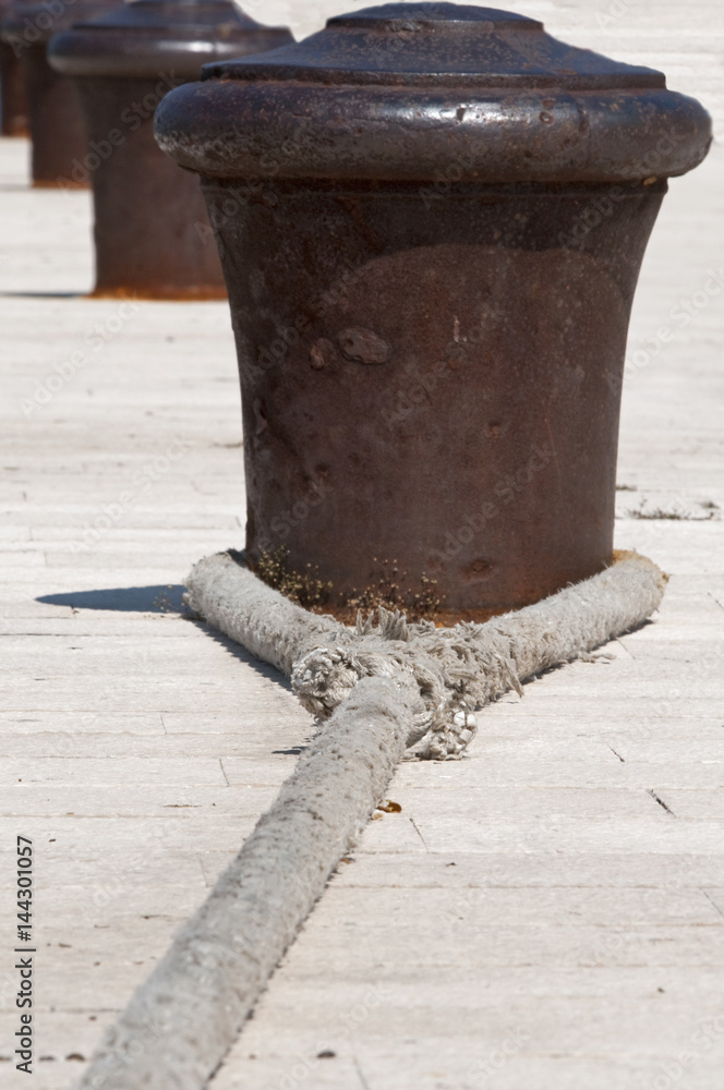 An old rusty bollard in a harbour in Croatia An old rusty bollard in a harbour in Croatia