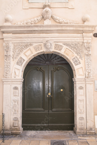 Engraved door in the historic center of Nîmes