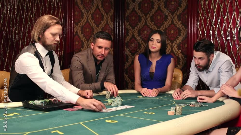 A young man is happy from winning in poker A young man is happy from winning in poker