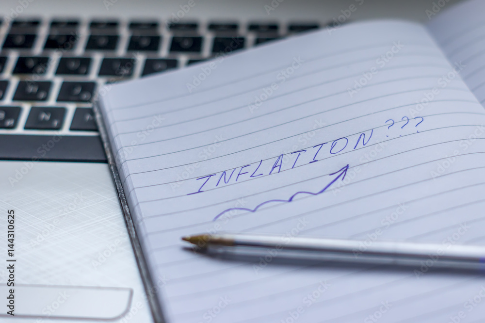 Inflation : Wrote Words On a handbook with note book, pen and notebook Inflation : Wrote Words On a handbook with note book, pen and notebook
