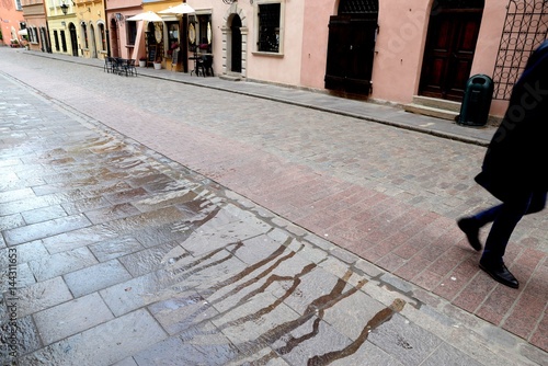 Obraz na płótnie broke pavement on a cobbled street in the Old Town in Warsaw w salonie
