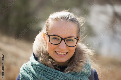 Beautiful girl with glasses in the wind