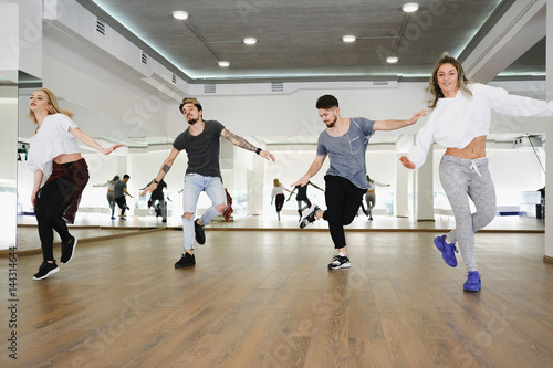 Принти на полотні Group of young modern dancers dancing in the studio