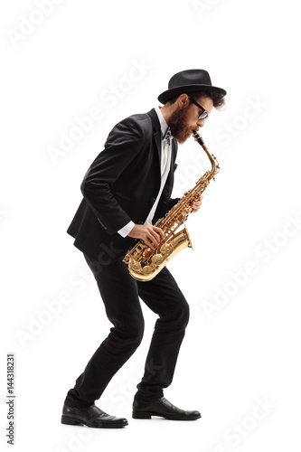 Bearded man playing a saxophone