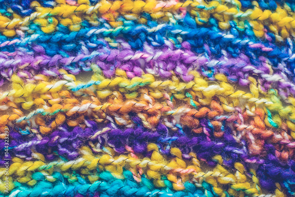 Colorful knitted background. Closeup of crochet blanket