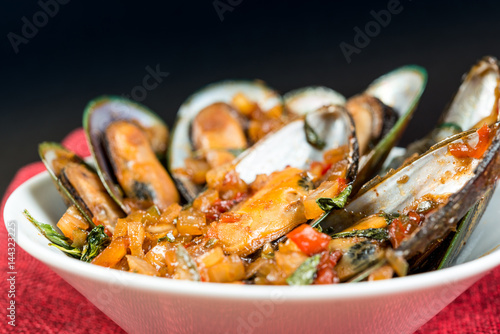 Mussel with white wine sauce on table
