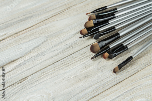Makeup brushes in the corner on background
