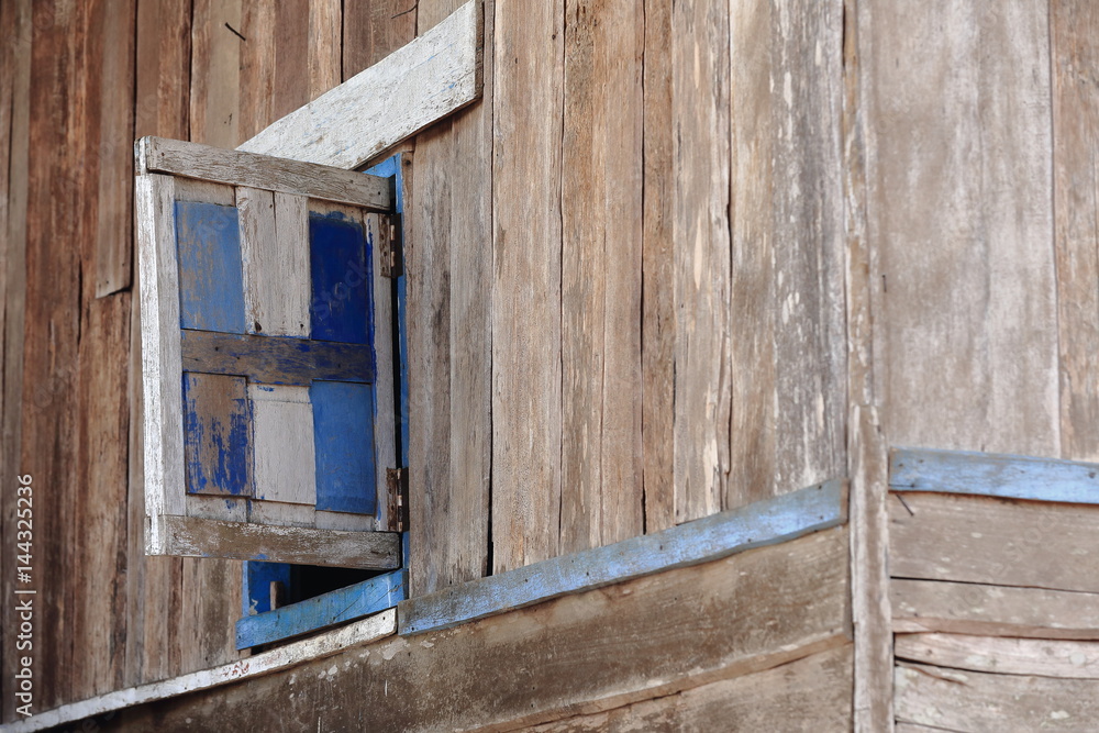 Window on wooden wall-Lu tribe. SopChem village-Luang Prabang province-Laos. 3962