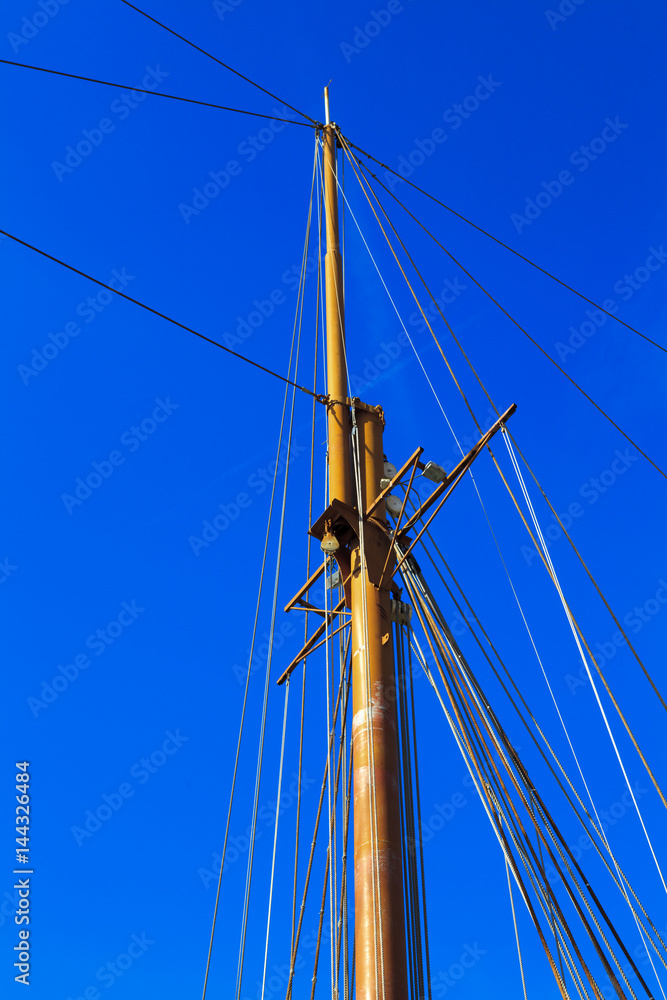 Yacht mast against blue summer sky Yacht mast against blue summer sky