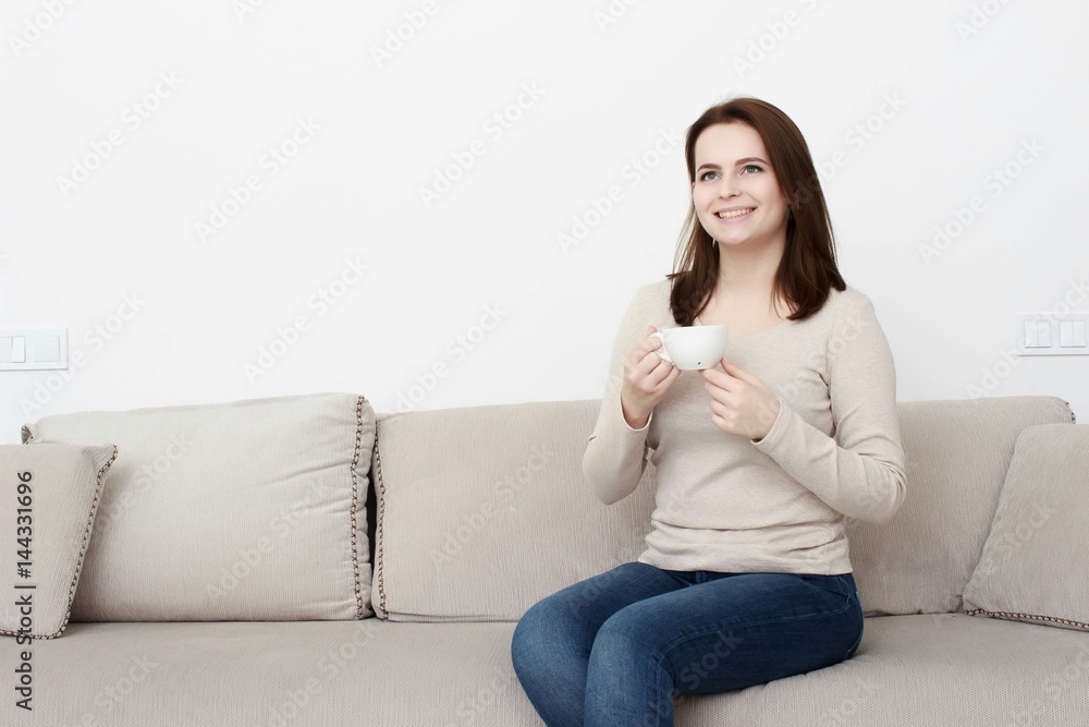 Beautiful young woman watching television Beautiful young woman watching television