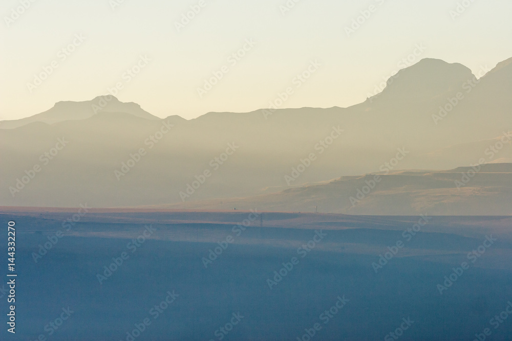 A winter fog settles over a valley in the early morning, Free state, South Africa.